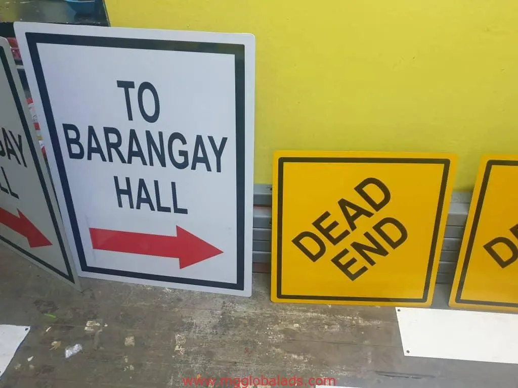 Acrylic indoor signage for barangay hall and dead end in Makati, on wood floor by M&G Global Ads.
