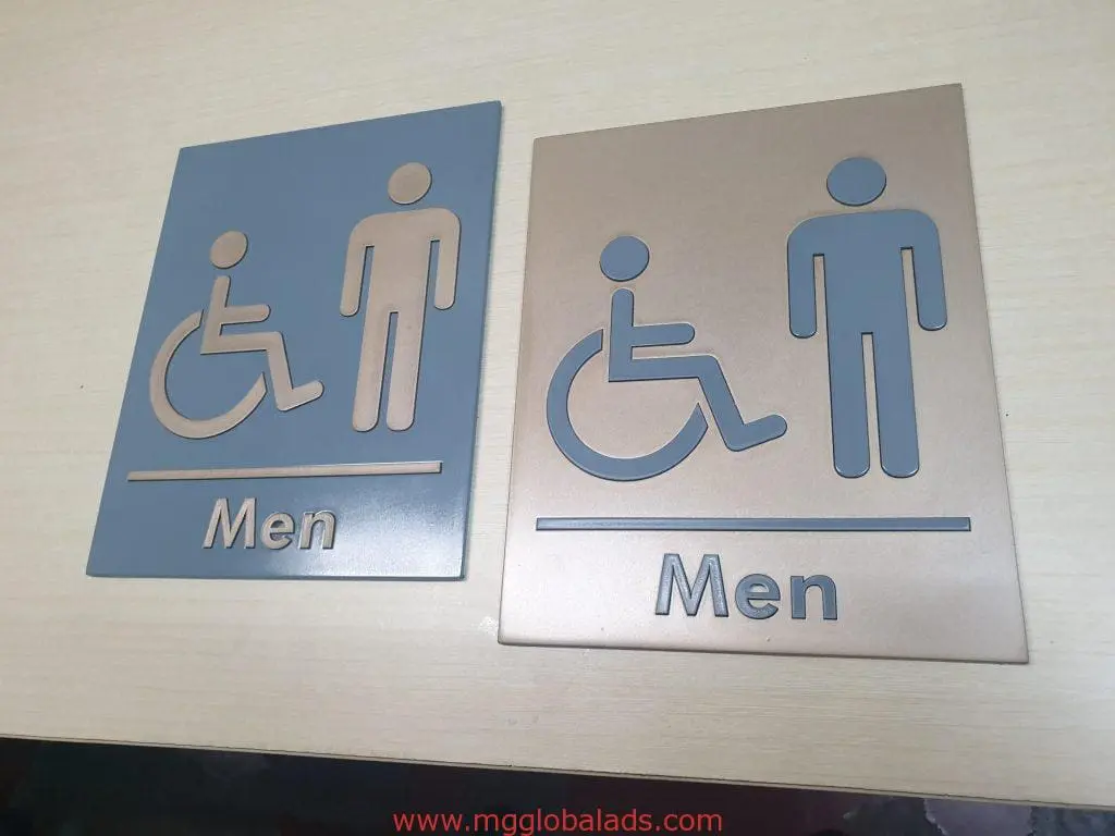 Acrylic men’s restroom signage with wheelchair symbol in Quezon City, gray and bronze variants by M&G Global Ads.