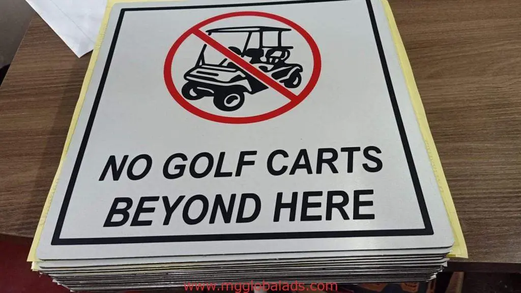 Indoor acrylic No Golf Carts sign at Mandaluyong with red circle & slash over golf cart icon, by M&G Global Ads.