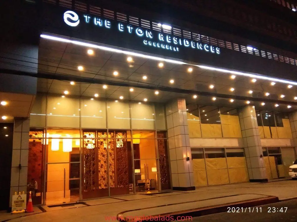 The Eton Residences Greenbelt with sleek LED signage, glass doors, and warm lighting in Makati by M&G Global Ads.