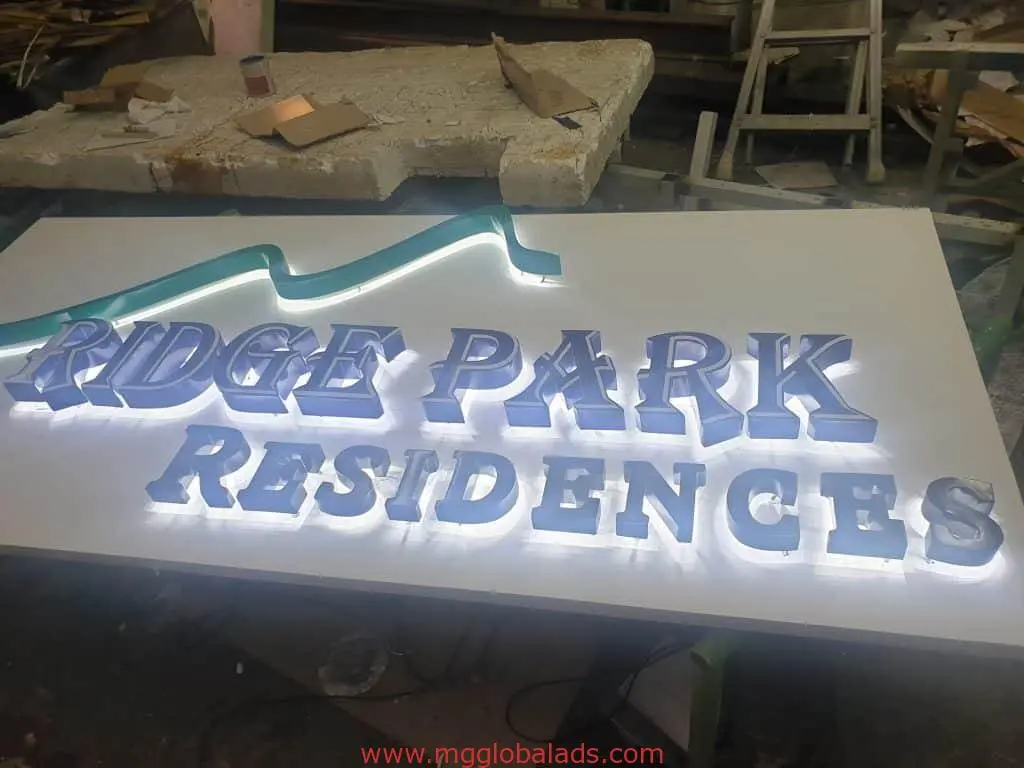 Illuminated acrylic 3D signage for Ridge Park Residences, blue ridge design, workshop setting in Makati by M&G Global Ads.
