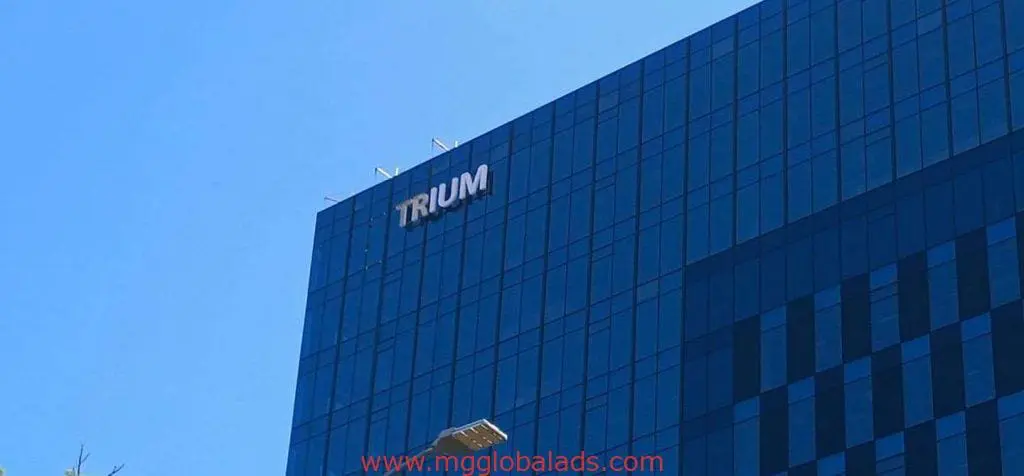 Acrylic building signage for Trump on a tall glass tower in Makati, partial sign missing, by M&G Global Ads.