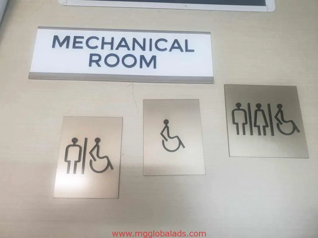 Custom metallic room and restroom signage with accessibility icons for client in Makati by M&G Global Ads.