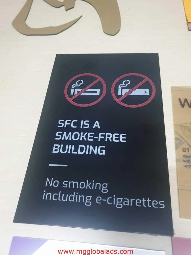 Building no smoking and no e-cigarettes signage for SFC in Ortigas, placed on a light surface, by M&G Global Ads.
