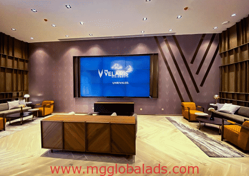 Digital LED screen signage for Velaris Unrivaled in a modern lounge, geometric walls, Makati location by M&G Global Ads.