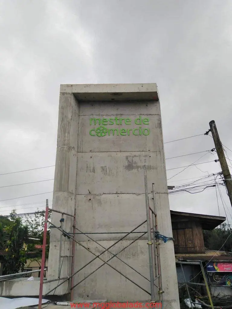 Green building signage for mestre de comércio with scaffolding, Makati location, by M&G Global Ads.