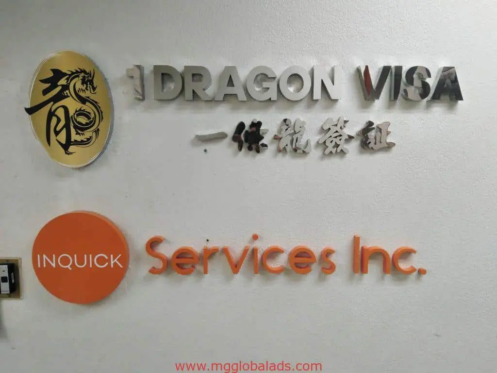 Indoor acrylic signage for Dragon Visa and Inquick Services Inc. in Makati office interior by M&G Global Ads.