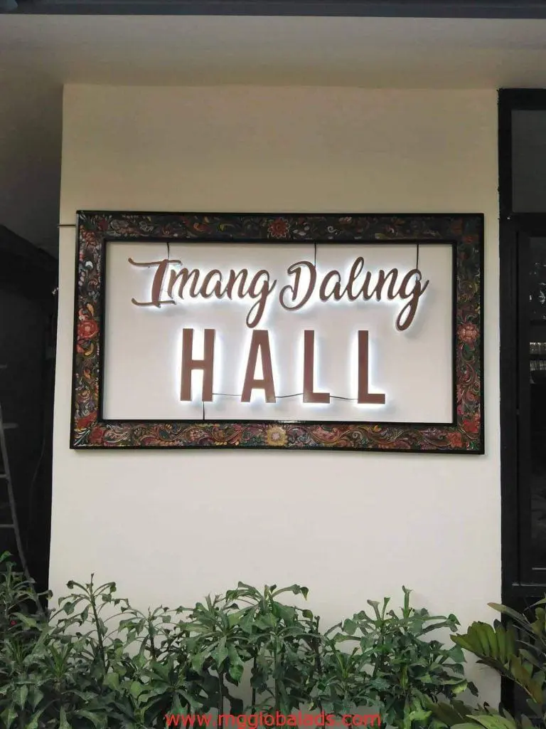 Illuminated decorative metallic signage for Imang Dalung HALL on beige wall with floral frame in Quezon City by M&G Global Ads.