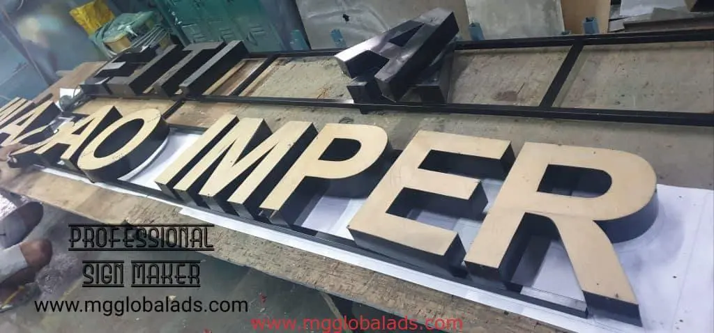 Metallic building signage letters for Makati client on workshop table, PROFESSIONAL SIGN MAKER by M&G Global Ads.