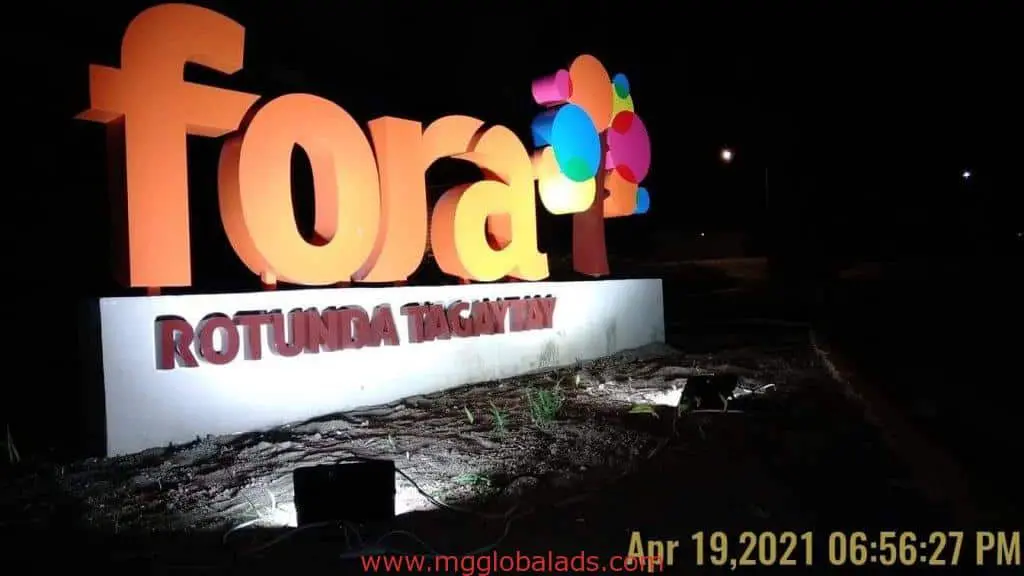 Illuminated outdoor signage for Fora Rotunda Tagaytay with balloons at night, Quezon City location, by M&G Global Ads.