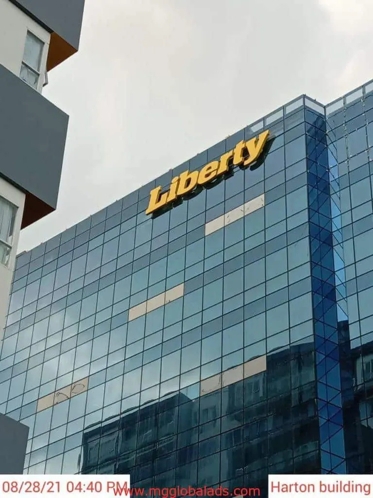 Liberty building signage for Harton on modern glass building, Makati, by M&G Global Ads.