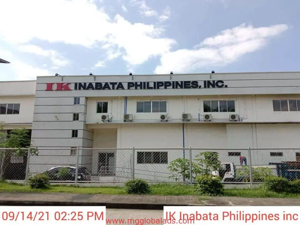 IK Inabata Philippines, Inc. office with metallic building signage in Makati, white facade, by M&G Global Ads.