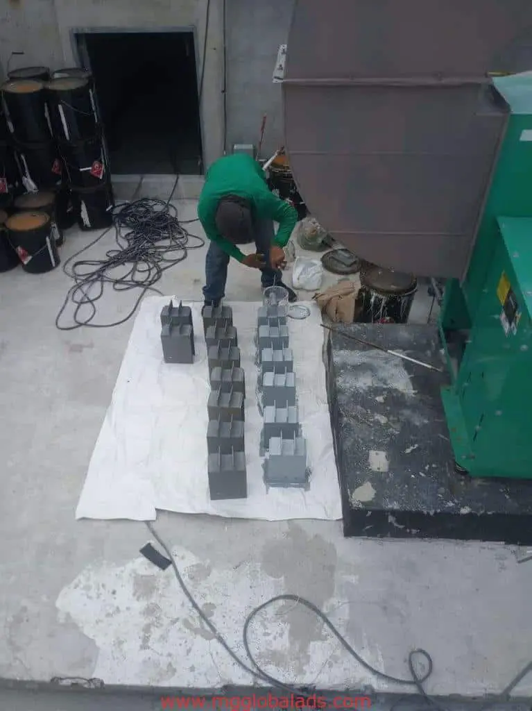 Fabricating and spray-painting rectangular metal signage parts for a client in Makati by M&G Global Ads.