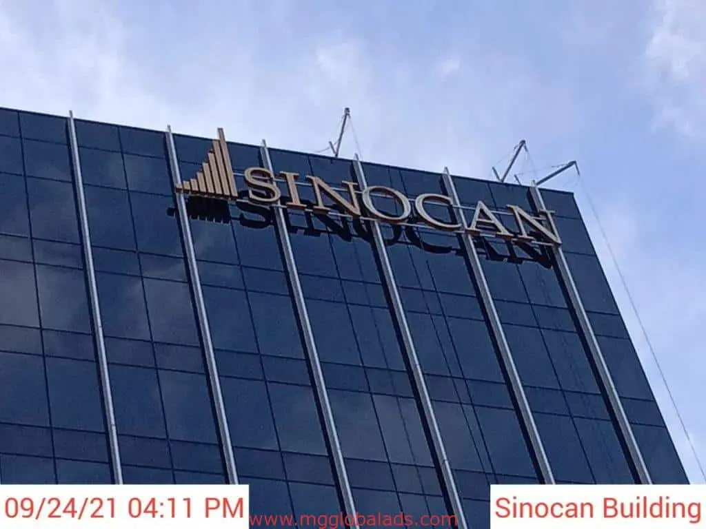 Gold acrylic signage for Sinocan on glass building, Makati location, by M&G Global Ads.