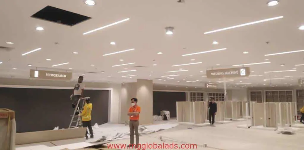 Outdoor appliance store signage for REFRIGERATOR and WASHING MACHINE in Makati, setup in progress by M&G Global Ads.