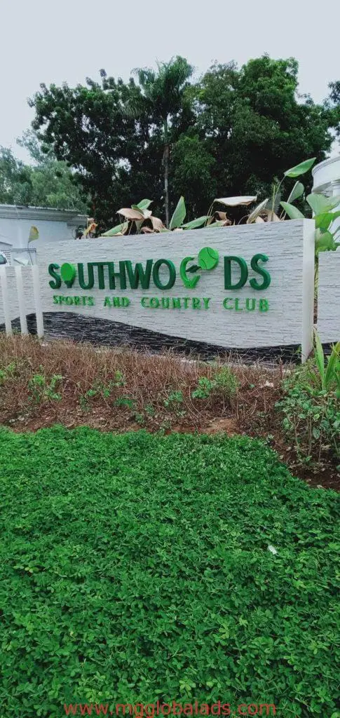 Outdoor pylon signage for Southwoods Sports and Country Club in Ortigas, surrounded by greenery and cars, by M&G Global Ads.
