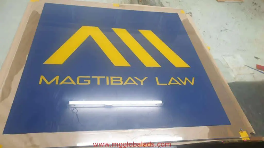 Building signage for MAGTIBAY LAW, blue metallic with yellow lines, in Ortigas, by M&G Global Ads.