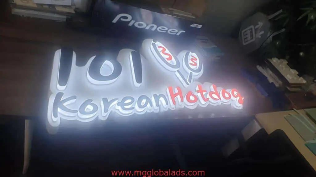 Illuminated LED signage for 101 Korean Hotdog Makati, shows stylized text and cartoon hotdogs. By M&G Global Ads.