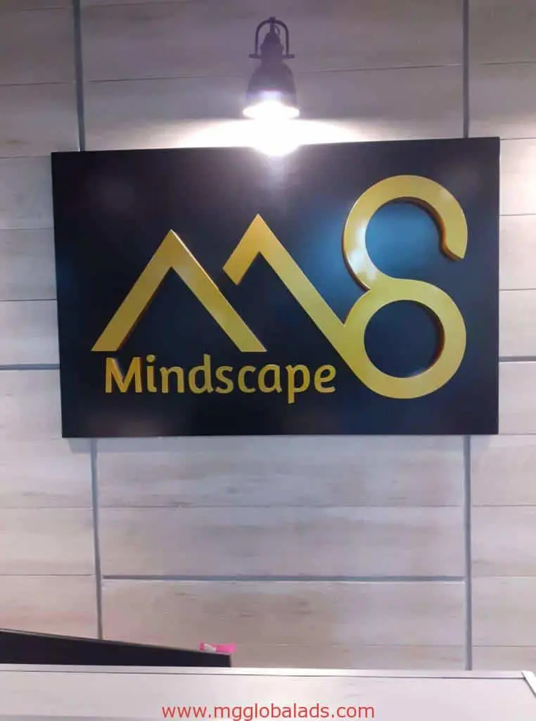 Acrylic office signage for Mindscape with gold M8 logo, wall-mounted in Makati, illuminated above. By M&G Global Ads.
