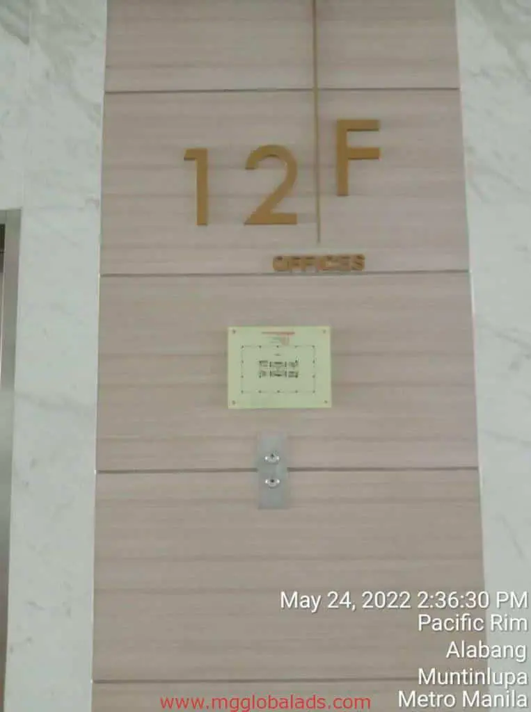 Indoor elevator lobby signage 12F OFFICES in gold letters, elevator button, Makati location by M&G Global Ads.