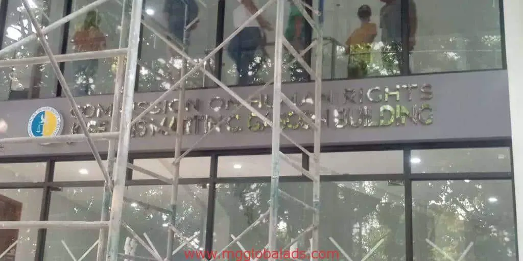 Building signage for Commission on Human Rights - Rights Training Center in Mandaluyong with scaffolding by M&G Global Ads.