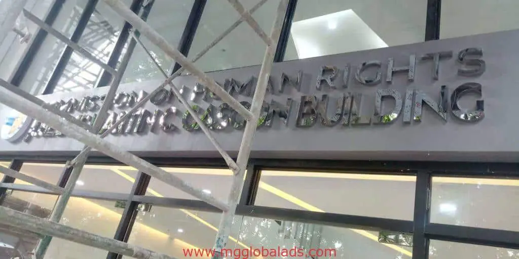 Commission on Human Rights building signage with scaffolding in front, Quezon City location by M&G Global Ads.
