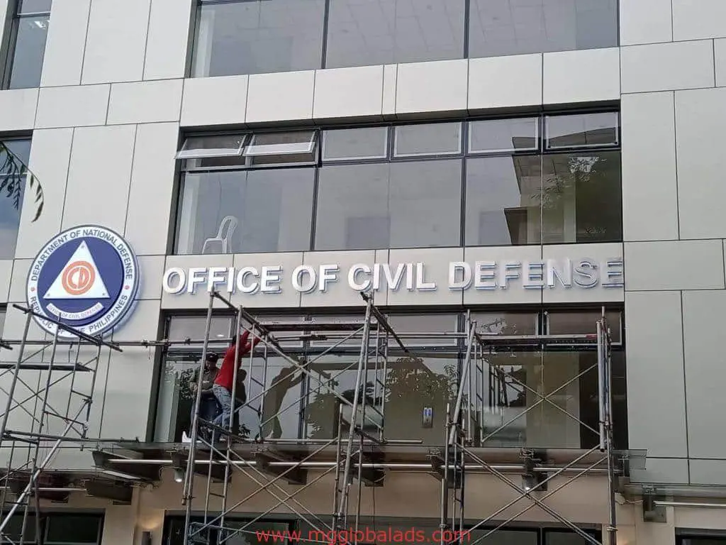 Office of Civil Defense channel letter signage installation in Quezon City, visible logo on building facade by M&G Global Ads.