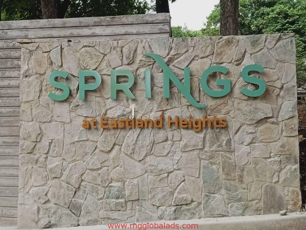 Green LED wall signage for Eastland Heights with SPRINGS logo, Quezon City location, by M&G Global Ads.