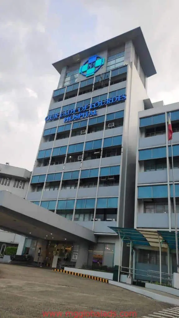 Outdoor hospital building signage for Our Lady of Lourdes Hospital, Quezon City, blue-white facade with large windows by M&G Global Ads.