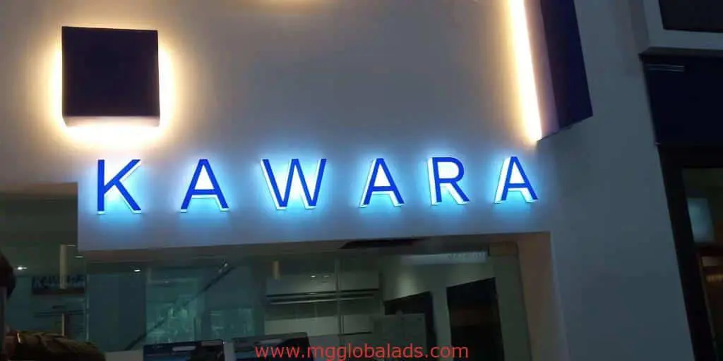 Illuminated acrylic signage for KAWARA in blue letters, modern indoor setting in Makati, by M&G Global Ads.