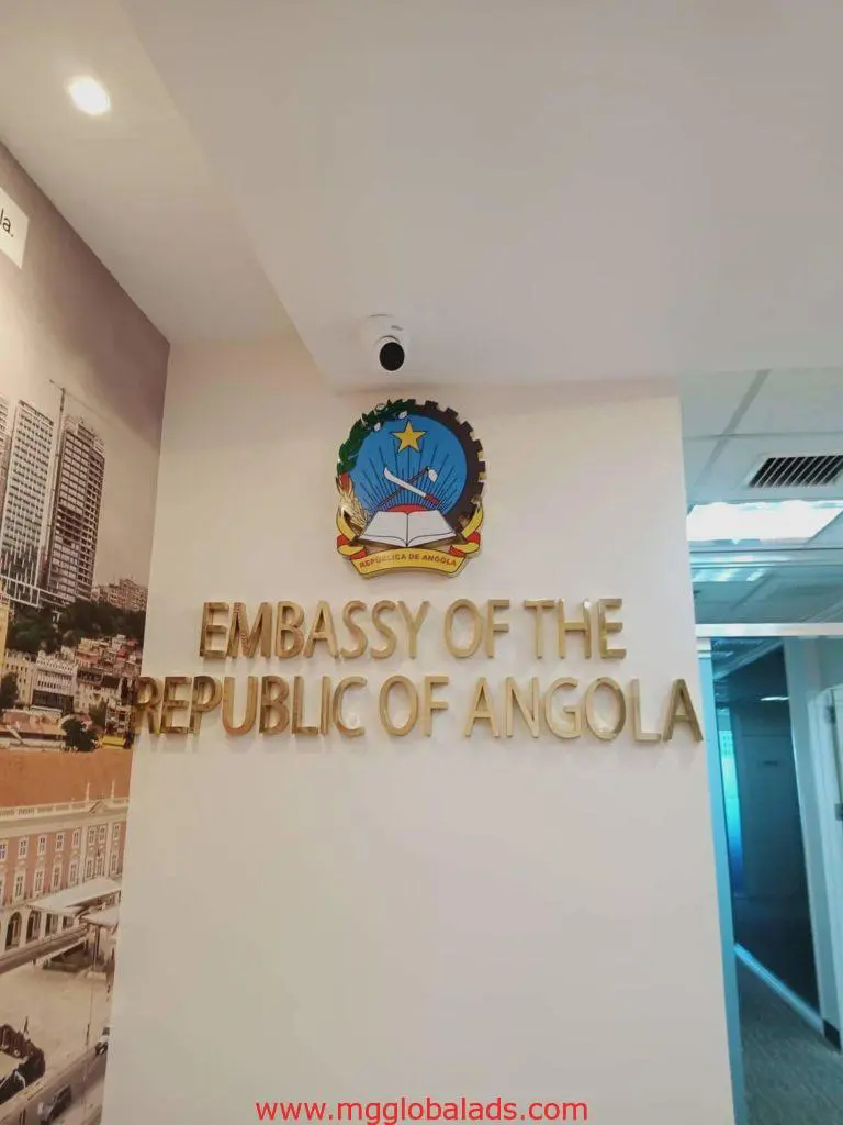 brass embassy signage for Republic of Angola with gold letters, wall-mounted in Makati building by M&G Global Ads.
