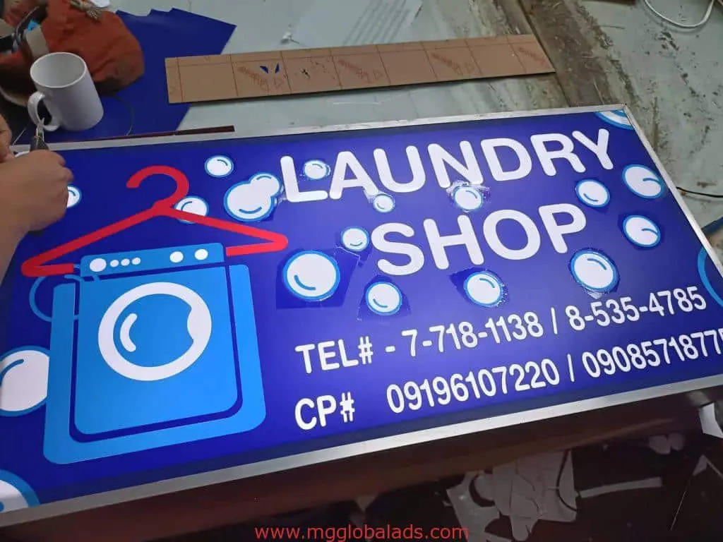 Laundry Shop metallic signage with washing machine graphic, contact info, in Makati by M&G Global Ads.