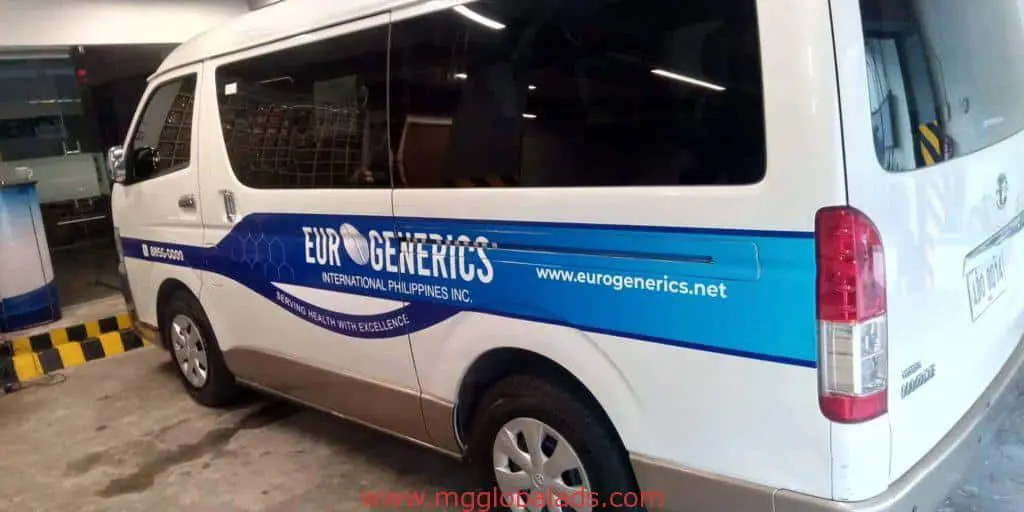 Euro Generics International van with bold building signage in Quezon City, company logo, website, and slogan by M&G Global Ads.