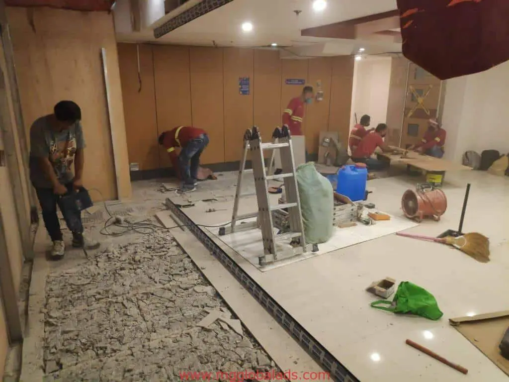 LED signage installation for a commercial client in Ortigas with workers renovating the interior by M&G Global Ads.