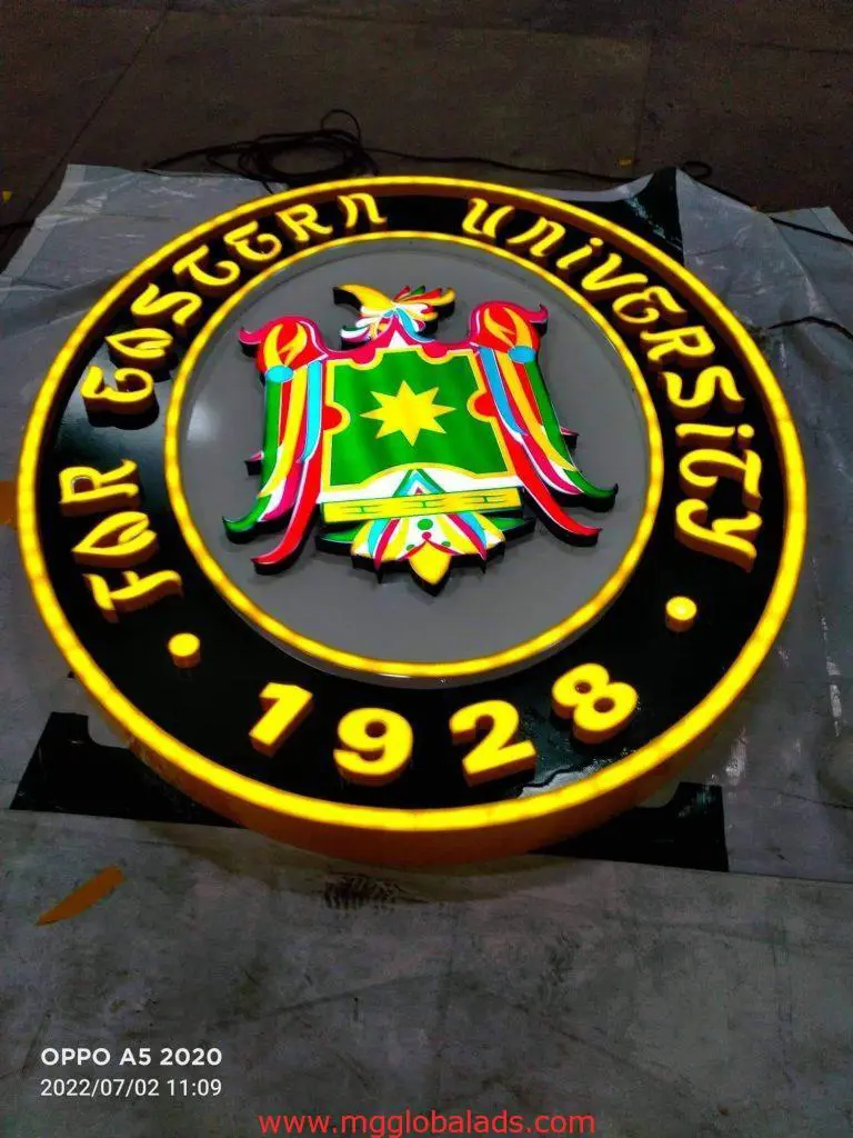 Acrylic signage for Far Eastern University FEU in Quezon City featuring green-yellow shield emblem by M&G Global Ads.