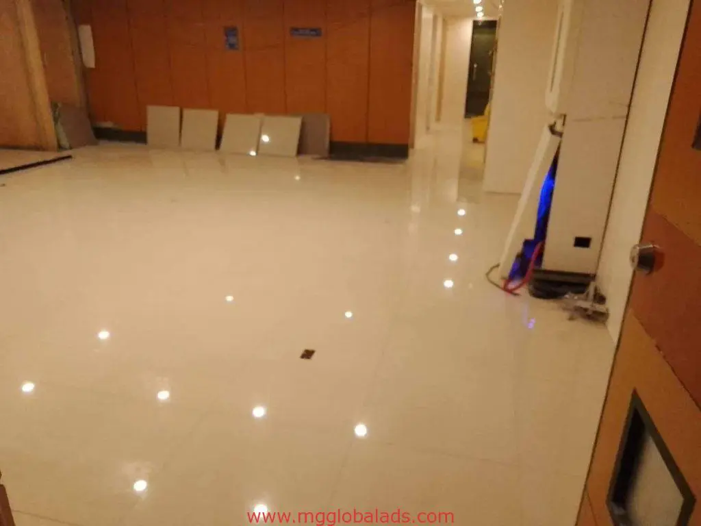 Indoor signage installation room with white tile floors and wooden walls in Quezon City by M&G Global Ads.