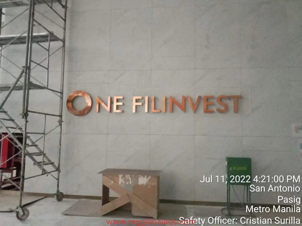 ONE FILINVEST metallic acrylic signage installation for Filinvest in Ortigas, Metro Manila by M&G Global Ads.