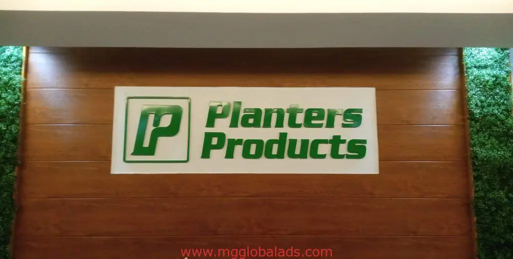 Outdoor logo signage for Planters Products in Makati, green lettering and stylized P on white, by M&G Global Ads.