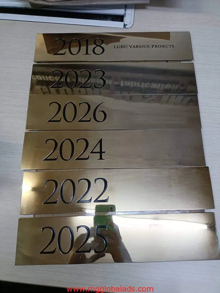 Acrylic signage plaques for LGBU VARIOUS PROJECTS, gold finish, in Makati, awards display by M&G Global Ads.