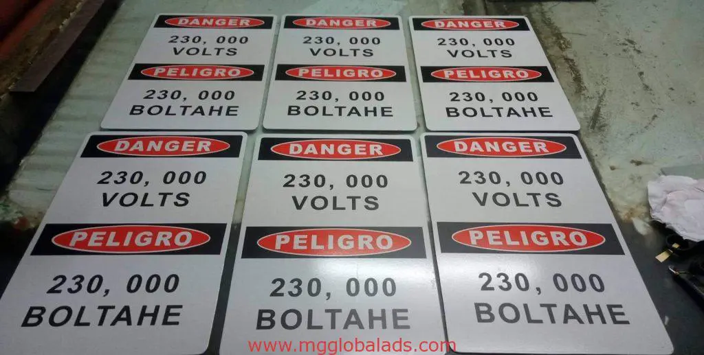 High voltage outdoor safety signage, English and Spanish, Makati location by M&G Global Ads.