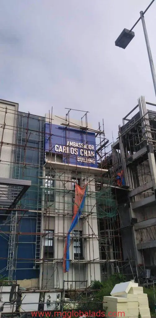 Acrylic signage for AMBASSADOR CARLOS CHAN BUILDING, construction site in Ortigas, by M&G Global Ads.