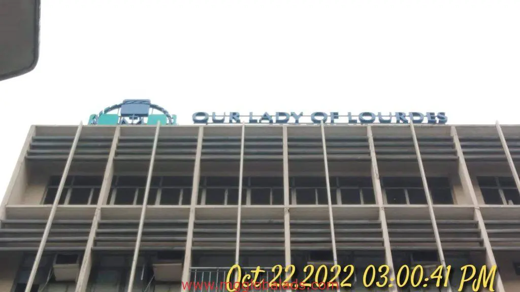 Outdoor LED signage for Our Lady of Lourdes on building in Makati, timestamped Oct 22, 2022, by M&G Global Ads.