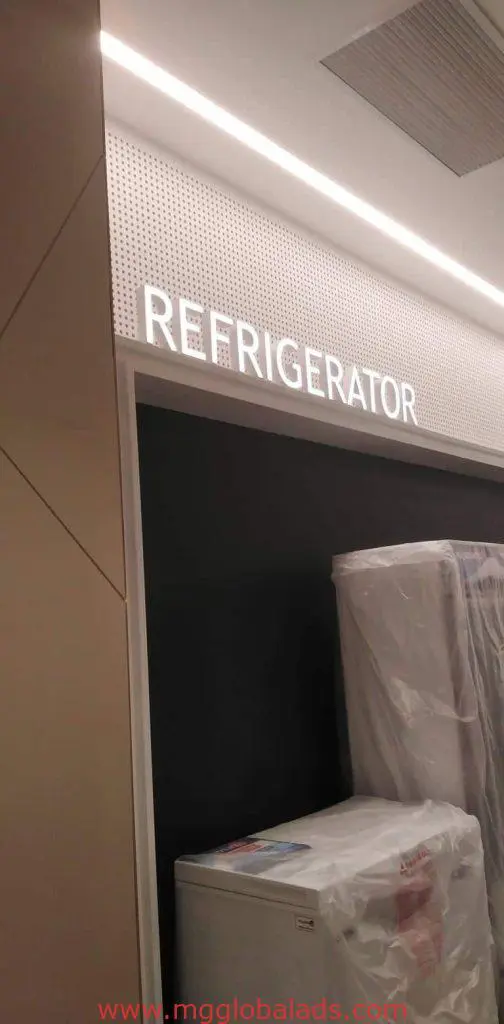 Illuminated acrylic REFRIGERATOR signage at appliance display area, Quezon City store under bright lighting by M&G Global Ads.