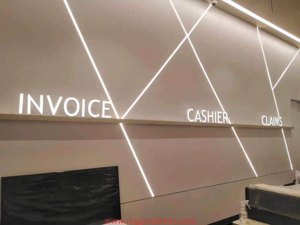 Acrylic indoor signage—INVOICE, CASHIER, CLAIMS—with LED lighting at a Makati service counter wall by M&G Global Ads.