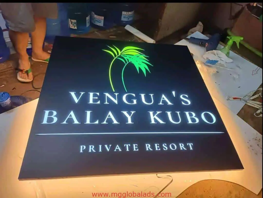 Illuminated metallic resort signage for Venguas Balay Kubo in Makati, with palm tree logo, by M&G Global Ads.