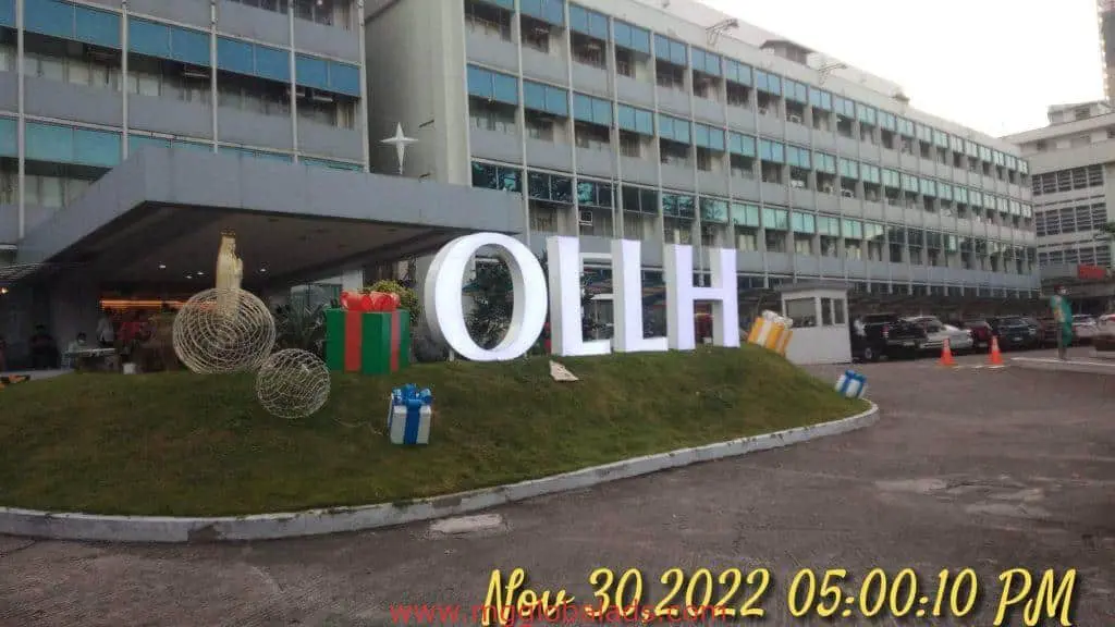 Large LED signage for OLLH with Christmas decor outdoors in Quezon City, by M&G Global Ads.