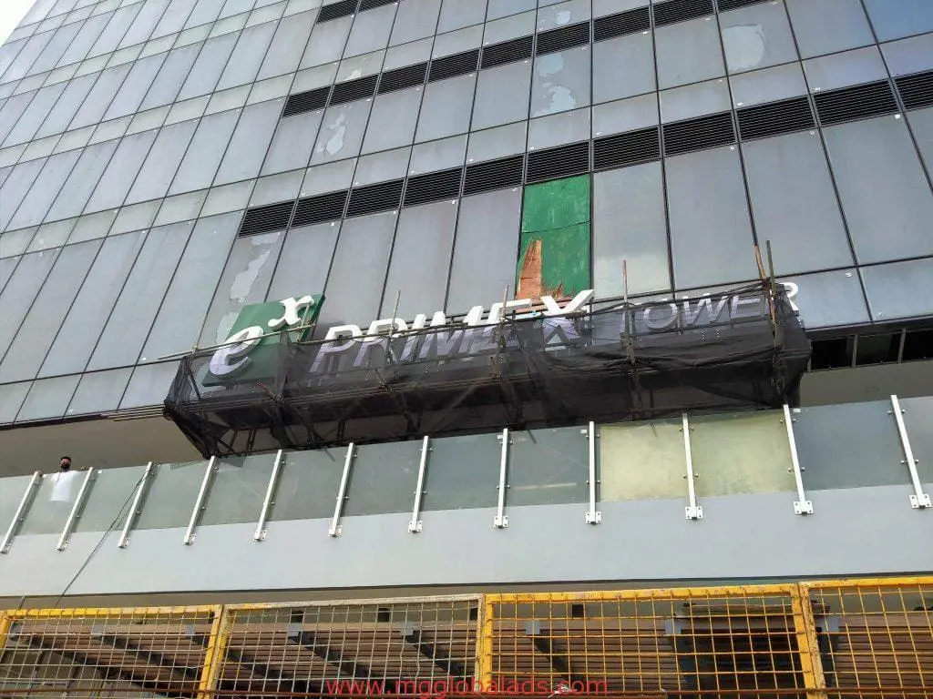 PRIMEX TOWER outdoor building signage in Ortigas, partially covered by black construction material, by M&G Global Ads.