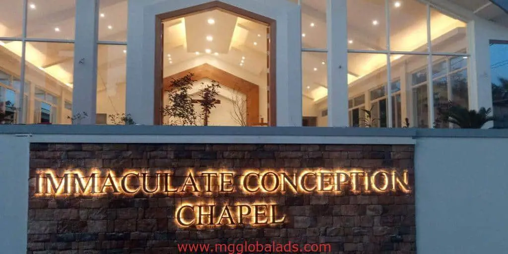 Metallic outdoor chapel signage for Immaculate Conception Chapel in Pasig by M&G Global Ads, seen at dusk with glowing interior.