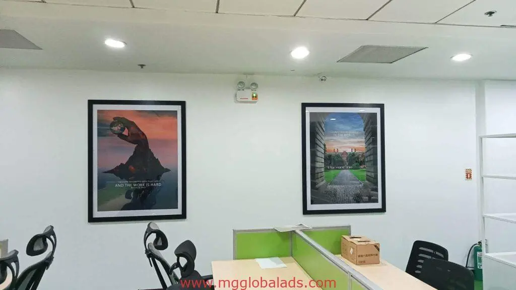 Office with LED signage, green and white desks, black chairs, posters on wall in Ortigas by M&G Global Ads.
