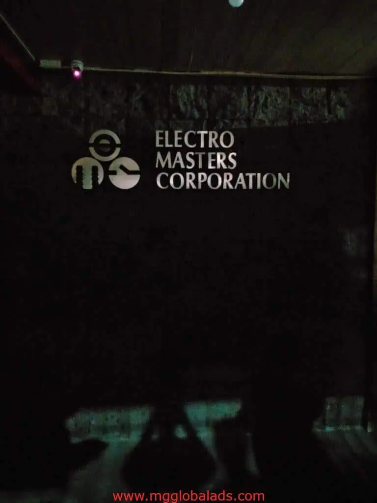 Indoor acrylic signage for ELECTRO MASTERS CORPORATION with logo, dimly lit, Makati location, by M&G Global Ads.